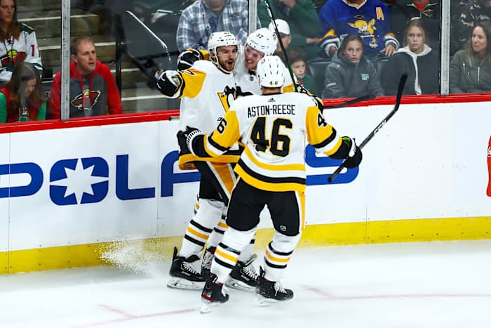 Oct 12, 2019; Saint Paul, MN, USA; Pittsburgh Penguins center Adam Johnson (47) celebrates with center Zach Aston-Reese (46) after Johnson scored a goal against the Minnesota Wild in the second period at Xcel Energy Center. 